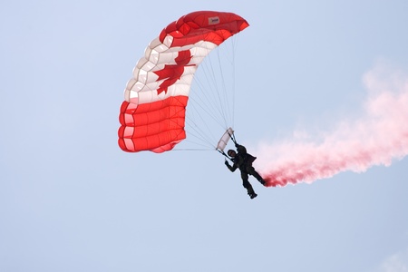 June 26, 2011. St. Thomas Ontario Canada. Members of the Canadian Forces parachute team the "Skyhawks" make their way to the ground during an exhibition at the Great Lakes International Air Show in St. Thomas Ontario.のeditorial素材