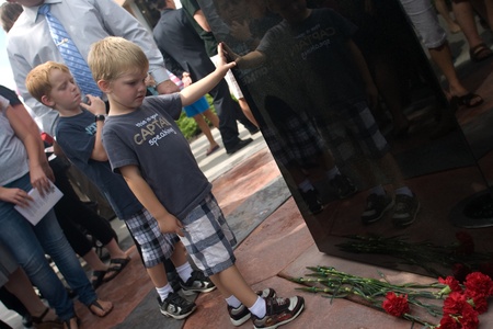 London, Canada - September 11, 2011: On the 10th anniversary of the attacks on the United States, the London Ontario Fire Department unveiled a monument honouring the 21 London Firefighters who lost their lives while on the job. Cody and Brycen Wallis looのeditorial素材