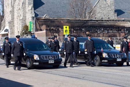 March 24, 2011. Listowel, Ontario. Thousands of firefighters from Ontario, Quebec and the United States converged on Listowel to honour volunteer firefighters Ken Rae 56 and Raymond Walter 30. The two died while battling a fire on March 17, 2011. のeditorial素材