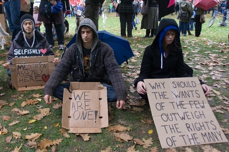 Toronto Ontario, Canada - October 15, 2011. The Occupy Wall Street movement emerged in a number of Canadian cities on Saturday. In Toronto a crowd that grew to 3000 gathered at King and Bay then marched and occupied St. James Park. のeditorial素材