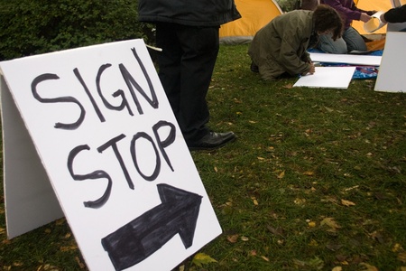 Toronto Ontario, Canada - October 15, 2011. The Occupy Wall Street movement emerged in a number of Canadian cities on Saturday. In Toronto a crowd that grew to 3000 gathered at King and Bay then marched and occupied St. James Park. のeditorial素材