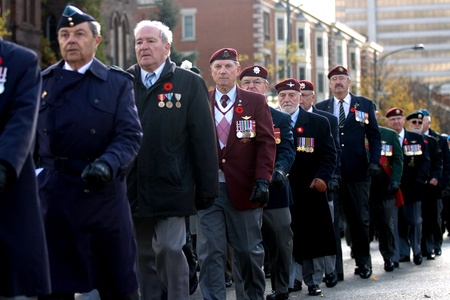 London Ontario, Canada - November 11, 2011. Veterans march during Remembrance Day ceremonies at the Cenotaph in Victoria Park in London Ontario Canada. のeditorial素材