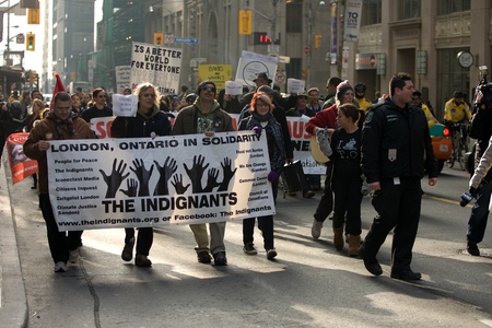Toronto Ontario, Canada - November 24, 2011. Protestors from Occupy Toronto, London, Kingston and Ottawa join Ontario Federation of Labour members led by Sid Ryan march through the financial district of Toronto. のeditorial素材