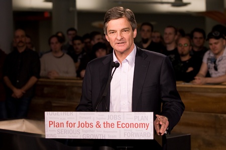 London Ontario, Canada - November 28, 2011. Chris Bentley, MPP - London West and Minister of Environment for Ontario introduces Premier Dalton McGuinty at a funding announcement at Digital Extremes - a computer game design firm located in London.のeditorial素材