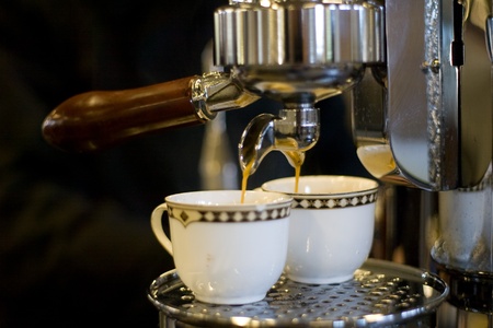 London Ontario, Canada - April 5, 2012. Expresso pours from an Italian made Elecktra expresso machine installed at Habitual Chocolate at the London Farmers Market. のeditorial素材