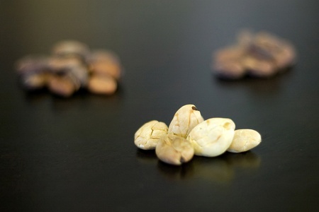 London Ontario, Canada - April 5, 2012. Rare Albino cocoa beans are displayed with their traditional darker beans behind. のeditorial素材