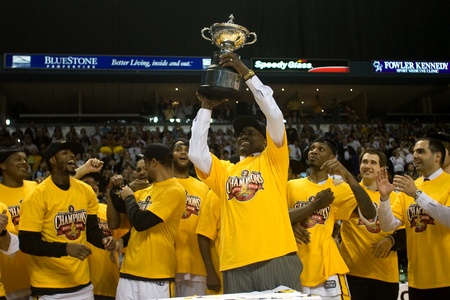 London Ontario, Canada - March 25, 2012. London Lightning coach and NBL Coach of the Year Michael Ray Richardson hoists the leagues championship trophy. The London Lightning defeated the Halifax Rainmen 116-92 in the fifth and deciding game to win the Natのeditorial素材