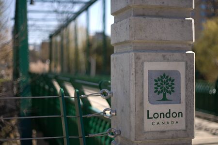 London Ontario, Canada - April 12, 2012. A newly built footbridge at the Forks of the Thames in London Ontaro with the City of London crest. のeditorial素材