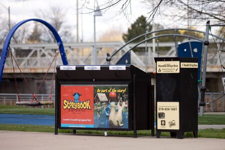 London Ontario, Canada - April 12, 2012. A needle drop box located near a public park in London Ontario Canada. The drop box is designed for I.V. drug users to provided them with a place to dispose of used needles. のeditorial素材