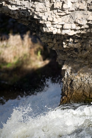 Elora Ontario, Canada - November 14, 2009. Located on the banks of the Irvine and Grand Rivers, the town is best known for its Limestone cliffs and gorge that plummets 70 feet into the Grand River below. The town attracts over 250,000 people each year. Poのeditorial素材