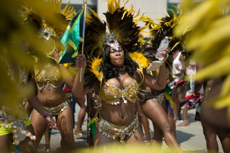 Toronto Ontario, Canada - August 4, 2012. The 47th annual Toronto Caribbean Carnival parade made its way down Lakeshore Avenue on a very hot August day. Formerly known as Caribbana, masqueraders in feather and sequined costumes entertained the crowd who lのeditorial素材