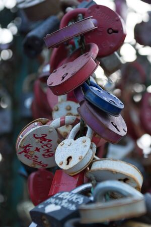 Love locks attached to the metal trees on the Luzhkov Most in Moscow, Russiaのeditorial素材