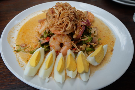 wing bean shrimp salad in white plateの写真素材