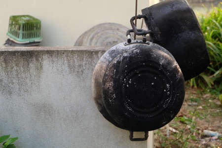 dirty old black pot homeの写真素材