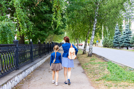 Mother and daughter walking in the park in late summer.の写真素材