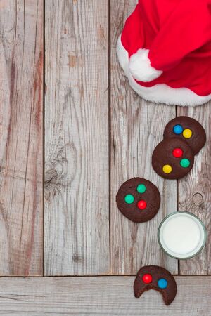 Christmas cookies and milk on wooden background.の写真素材