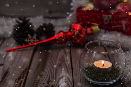 Beautiful christmas composition with candle on wooden backgroundの写真素材