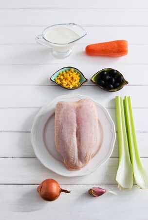 Colored foodstuffs - ingredients for cream chicken soup on a table.の写真素材