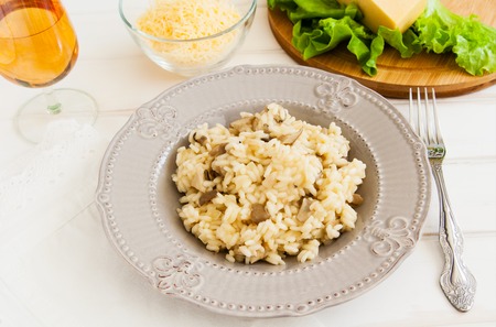 Useful mushroom risotto on a white background.の写真素材