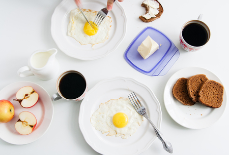 Healthy breakfast: fried egg with rye bread and coffee.の写真素材