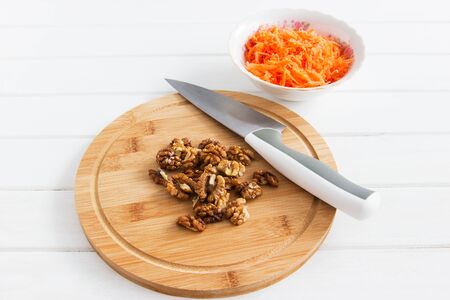 Whole walnut grated carrot cutting board knife