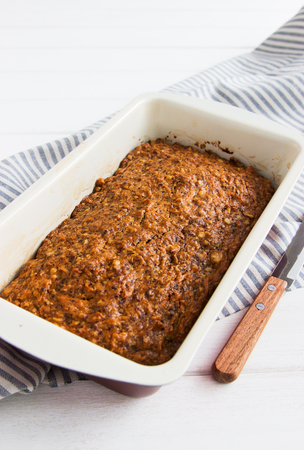 Vegan lenten carrot cake striped tablecloth white backgroundの写真素材