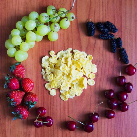 Concept Morning Homemade breakfast with assorted berry and cornflakes.の写真素材