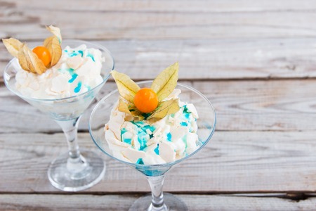 Eton mess blue curacao and ripe physalis.の写真素材