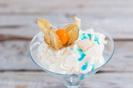 Eton mess meringue blue curacao and physalis.の写真素材