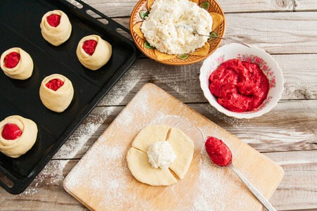 Sculpt russian round buns vatrushki with cottage cheese and strawberry cherry curd.