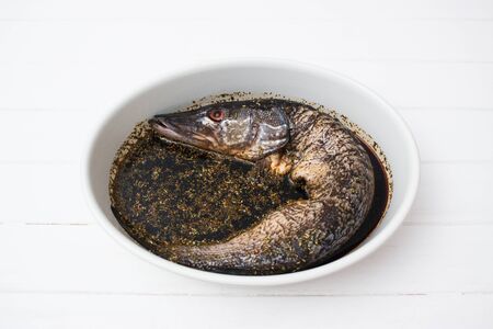 fish spicy soy sauce liquid marinade fruit white background.