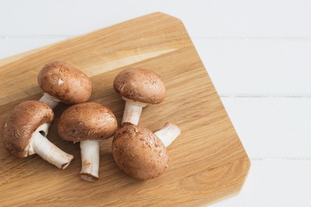 Raw brown champignons cutting board selective focus.の写真素材