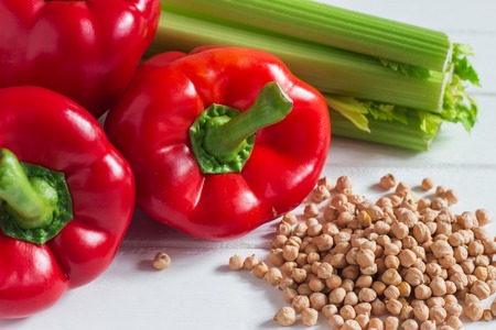 Red pepper celery chickpeas colored vegetarian products.の写真素材