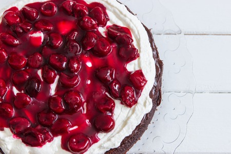Preparing black forest cake cherry filling inside.