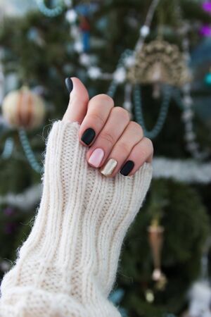 Beautiful christmas nail design sweater hand selective focus.の写真素材