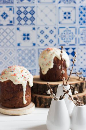 Russian easter bread kulich egg pussy-willow blue background selective focus.