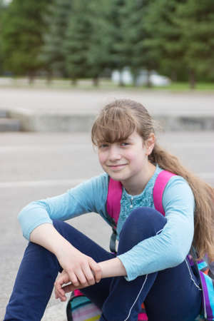 Cute blonde teenager girl trendy skateboard dynamic motion selective focus.の写真素材