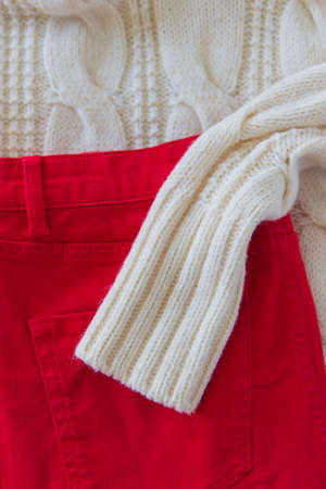 Clothing top view Christmas background red jeans.の写真素材