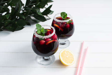Alcohol cranberry lemon wine peppermint festive cocktail.の写真素材