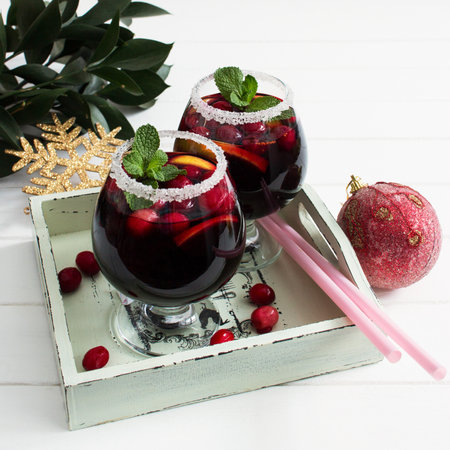 Alcohol cranberry lemon wine peppermint festive cocktail tray.の写真素材