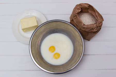 Foodstuffs on a white table - dough.