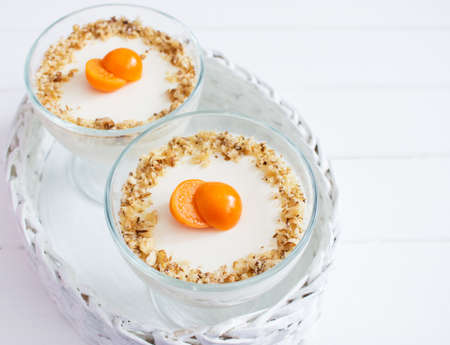 Physalis decorated panna cotta white wicker basket.の写真素材