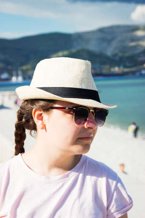 One teenager on sea coastline summer day vertical.の写真素材