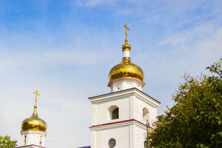 Golden church top blue sky background scenic countryside.の写真素材