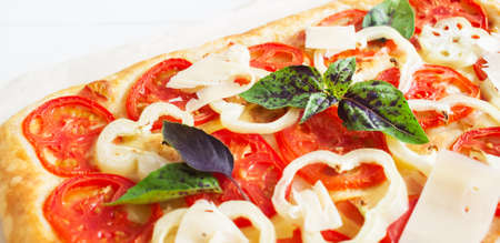 Ruddy hot rectangle tart bacon white wooden background paper selective focus.の写真素材