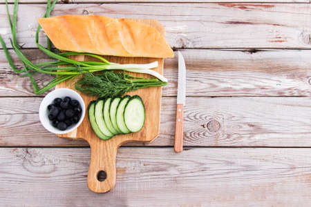 Ingredients for sandwiches wooden background top view.の写真素材