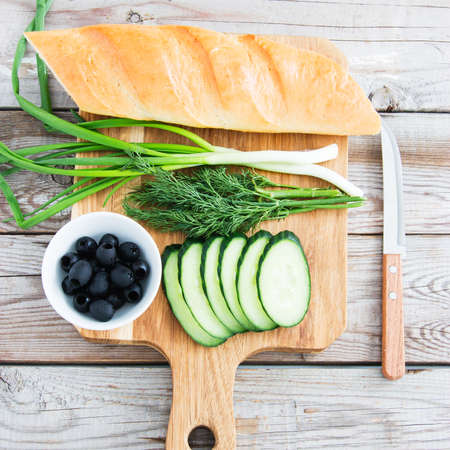 Ingredients for sandwiches wooden background top view.の写真素材