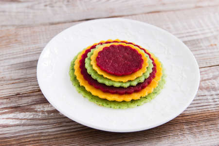 Russian crepes saucer on Maslenitsa wooden background .