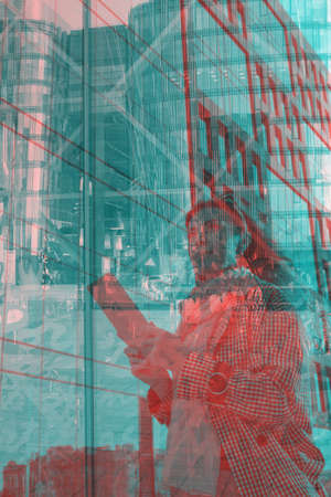 Successful woman near futuristic glass business center