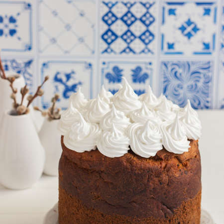 Blue background russian easter bread dome shaped meringue.の写真素材
